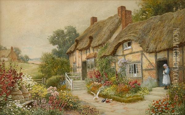 An English Country Garden With A Girl Outside A Thatched Cottage Oil Painting - Arthur Claude Strachan