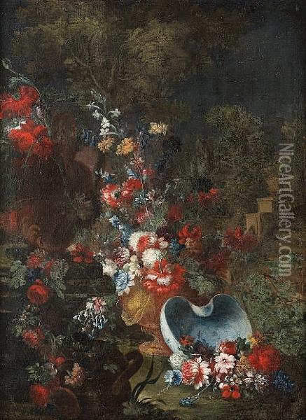 Carnations, Peonies, Cornflowers
 And Other Flowers In A Vase With A Blue And White Porcelain Basin And 
An Urn Decorated With A Swag Of Flowers In A Garden Oil Painting - Giuseppe Lavagna