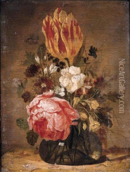 A Tulip, A Rose, A Violet And Other Flowers In A Glass Vase On Awooden Table Oil Painting - Jacques de Claeuw