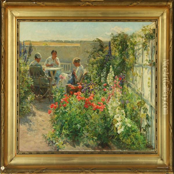 Three Women Seated At A Table In A Flowering Garden Oil Painting - Knud Larsen