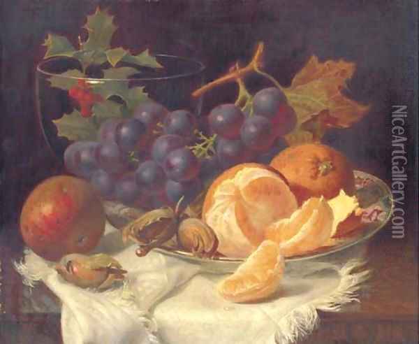 An apple, black grapes, two oranges and cob nuts on oriental plate, with holly in a glass vase, on a wooden table Oil Painting - Eloise Harriet Stannard