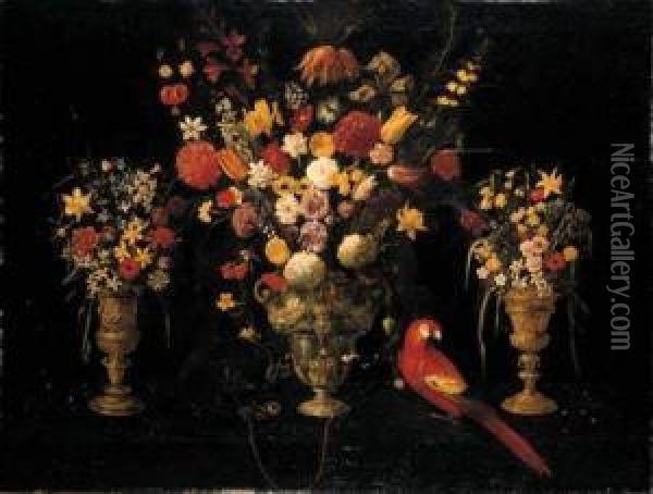 Tulips, Carnations, Irises, 
Daffodils, Hyacinths And Other Flowersin Three Ornamental Silver-gilt 
Standing Cups With A Parrot And Achained Squirrel Oil Painting - Astolfo Petrazzi