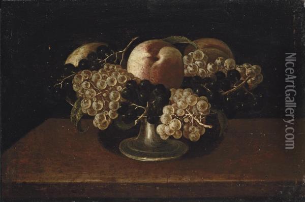 A Silver Tazza With White And Red Grapes And Peaches, On A Wooden Table Oil Painting - Panfilo Nuvolone