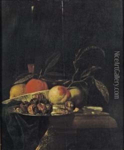 A Lemon And An Orange In A 
Porcelain Bowl, A Glass Of Wine, Dates On A Silver Plate, An Apple, A 
Peach And A Knife, All On A Partially Draped Table Oil Painting - Juriaen van Streeck