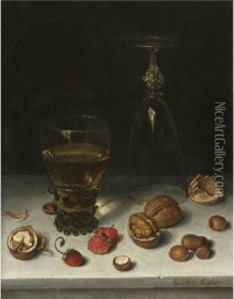 Still Life Of Walnuts, Hazelnuts, Strawberries, A Roemer And An Overturned Wine Glass, All Resting On A Table Oil Painting - Floris Claesz Van Dijck