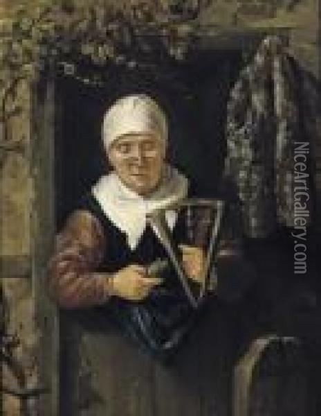 An Old Woman Standing In A Doorway Spinning Oil Painting - Nicolaes Maes