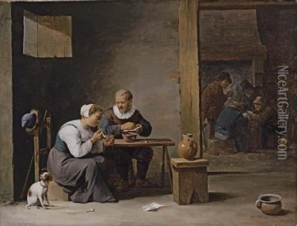 A Man And Woman Smoking A Pipe, 
Seated In An Interior, With Peasants Playing Cards Beyond Oil Painting - David The Younger Teniers