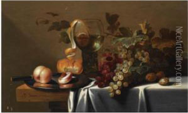 Still Life With Blue And White Grapes, Chestnuts, A Loaf Of Bread,peaches And A Knife On A Pewter Plate, With A Peeled Lemon In Aroemer, All Arranged On A Partly Draped Table Oil Painting - Michiel Simons
