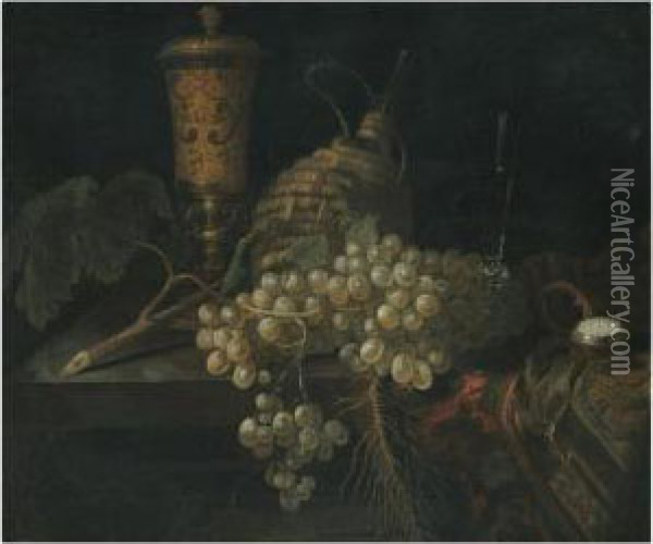 A Still Life With A Golden 
Goblet, A Flagon Of Wine, A Pocketwatch, A Bunch Of Grapes And Other 
Objects All Laid Out On A Stoneledge Partly Draped With A Carpet Oil Painting - Pieter Gerritsz. van Roestraten