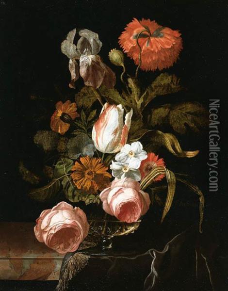 A Tulip, Roses, An Iris, A Peony And Other Flowers In A Glass Vaseon A Partially Draped Stone Ledge Oil Painting - Isaak Denies