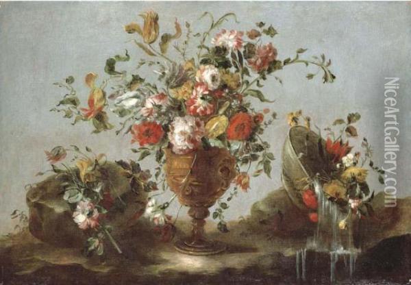 Roses, Peonies And Tulips In A 
Gold Sculpted Urn With Flowers In A Pewter Bowl By A Rock Pool Oil Painting - Francesco Guardi
