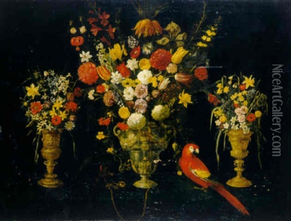 Tulips, Carnations, Irises, Daffodils, Hyacinths And Other Flowers In Three Silver-gilt Standing Cups With Parrot And Squirrel Oil Painting - Astolfo Petrazzi