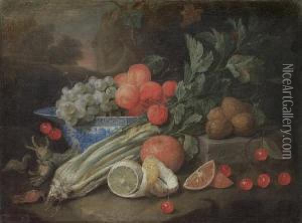 Apricots And Grapes In A Wan-li 
Kraak Blue Andwhite Bowl On A Table Ledge, With A Peeled Lemon, Celery, 
Cherriesand Walnuts, Before A Landscape Oil Painting - Joris Van Son