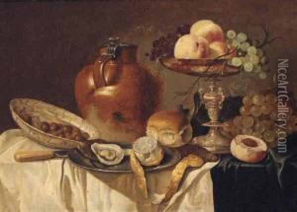An Oyster And A Peeled Lemon On A
 Pewter Plate, A Bread Roll, Astoneware Jug, A Knife, A Bowl Of Olives, 
Peaches And Grapes On Asilver-gilt Tazza, On A Draped Table Oil Painting - Pieter Claesz.