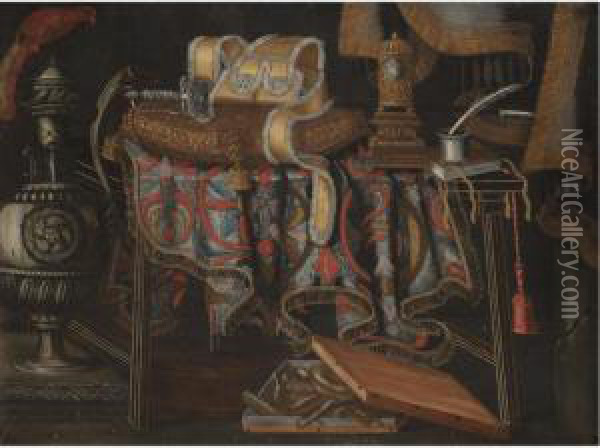 A Still Life With A Sword 
Resting On A Cushion, A Clock, A Book And An Inkwell On A Partly Draped 
Table Together With A Box Of Sweetmeats And An Urn In The Foreground Oil Painting - Francesco (Il Maltese) Fieravino