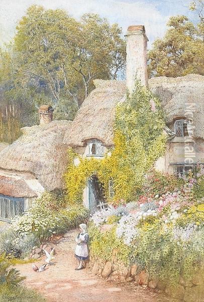 A Thatched Cottage With A Girl Feeding Pigeons By A Flower Bed In The Foreground Oil Painting - Arthur Claude Strachan