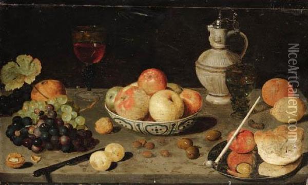 Grapes, Olives, Walnuts, 
Hazelnuts, An Orange, A Lemon, A Pomegranate, A Roemer, A Stoneware Ewer Oil Painting - Floris Claesz Van Dijck