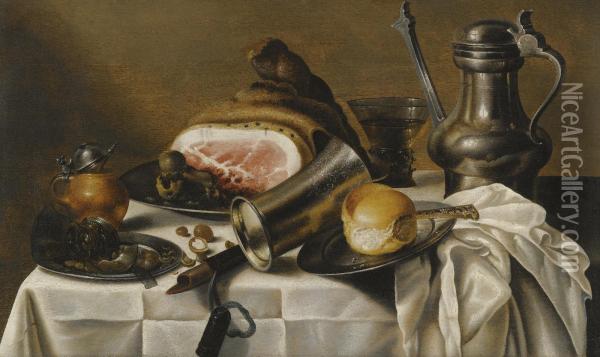 A Still Life Of Ham, A Pewter Plate, A Pewter Pitcher, A Glass Roemer, Hazelnuts, A Bread Roll And Other Objects On A White Table Cloth Oil Painting - Pieter Claesz.