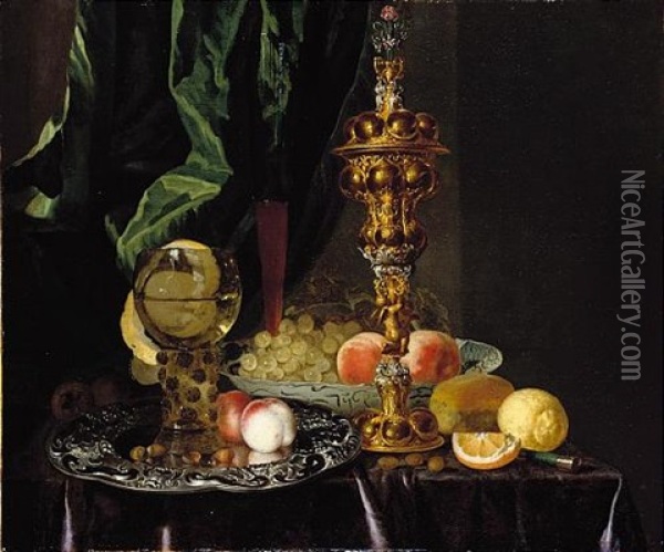 A Still Life Of Peaches, Grapes, A Lemon, A Segment Of Orange, Hazelnuts And A Bread Roll, Together With A Roemer, A Large Gold Pronckblokaal And A Silver Platter, All Laid Out On A Draped Table Oil Painting - Simon Luttichuys
