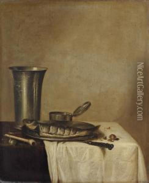 A Herring On A Pewter Platter, 
An Engraved Silver Tumbler, And A Pipe On A Partly-draped Table Oil Painting - Willem Claesz. Heda