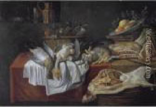 A Still Life With Numerous Birds
 In A Basket, Together With Rabbits, A Bowl Of Fruit, Asparagus, And Two
 Parrots On A Table Draped With Red And White Clothes, Together With A 
Side Of Lamb On A Basket Oil Painting - Pieter Van Boucle