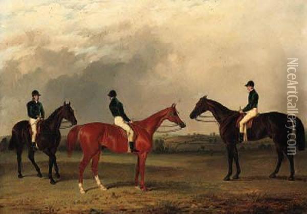 A Chestnut And Two Bay Racehorses With Jockeys Up In An Extensivelandscape Oil Painting - John Dalby Of York