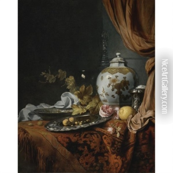 A Blue And White Faceted Vase, A Rose And Walnuts On A Pewter Plate, A Wan-li Kraak Porcelain Bowl, A Silver Wine Cooler, A Wineglass, A Glass, A Lemon And Roses On A Table Draped With A Carpet Oil Painting - Joseph de Bray