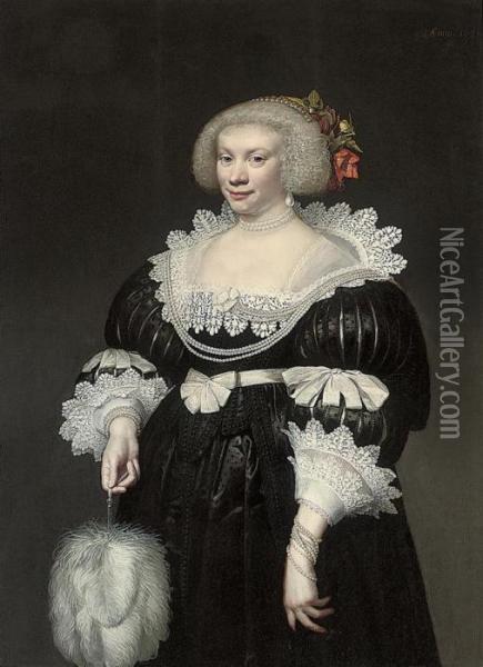 Portrait Of A Lady, 
Three-quarter Length, In A Black Slashed Silkdress With Lace Collar And 
Cuffs, A Fan In Her Right Hand Oil Painting - Jan Anthonisz Van Ravesteyn