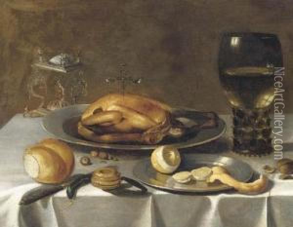 A Roemer Of Wine, A Turkey And A
 Partly-peeled Lemon On Pewterdishes, Bread And Hazelnuts On A Draped 
Table Oil Painting - Pieter Claesz.