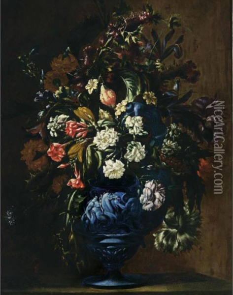 A Still Life With Roses, 
Carnations, Poppy Anemones, Cornflowers, Irises, Lilies And Other 
Flowers In A Blue Sculpted Stone Vase Oil Painting - Mario Nuzzi Mario Dei Fiori