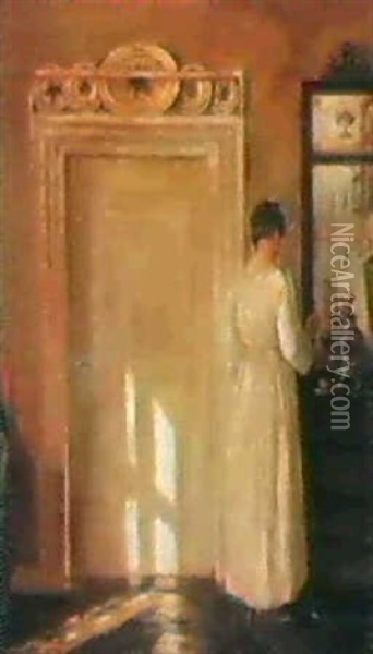 Interior Med En Dame Der Ordner Tingene Pa En Kommode Oil Painting - Carl Vilhelm Holsoe
