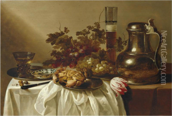 Still Life With A Pewter Flagon Together With A Glass Of Beer, Acrab, A Blue-and-white Dish And A Roemer On Pewter Dishes, Togetherwith A Knife, Hazelnuts, A Tulip And Bunches Of Grapes On A Tablepartly Draped With A White Cloth Oil Painting - Cornelis Cruys